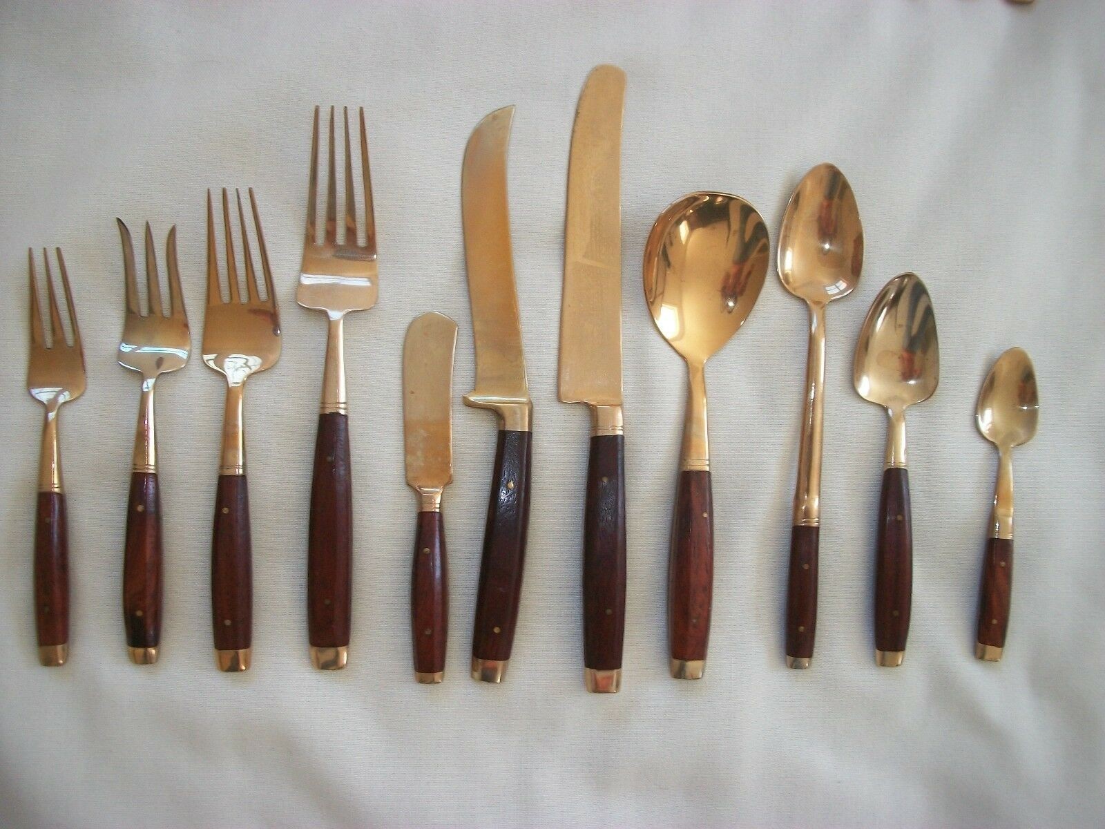 Brass and wood flatware set