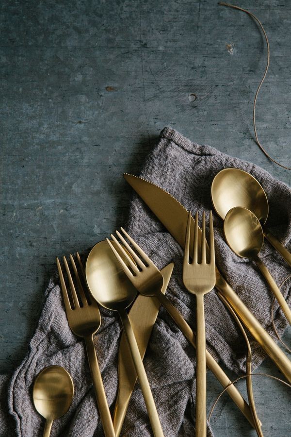 Teak and brass flatware set